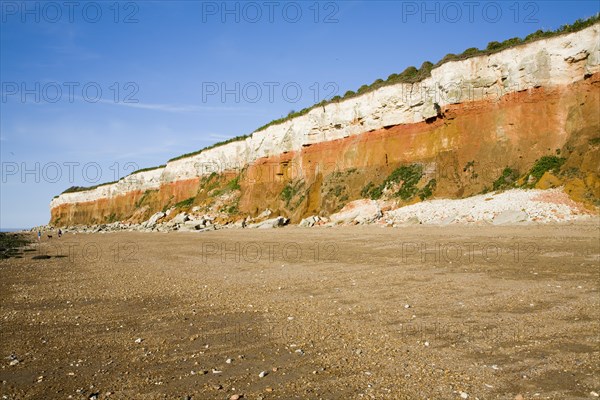 Chalk, red chalk and carstone form striped cliffs of white, red and orange at Hunstanton, Norfolk, England, United Kingdom, Europe