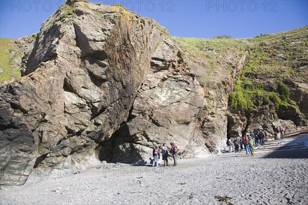 Student group of geologists on a fieldtrip at Polpeor Cove, Lizard Point, Cornwall, England, United Kingdom, Europe