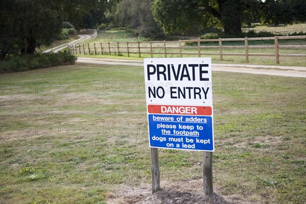 Private No entry sign warning of adder snakes, Wantisden, Suffolk, England, United Kingdom, Europe