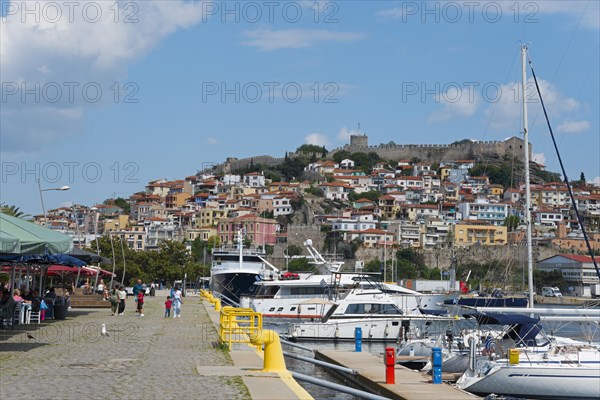 View of a lively harbour promenade with boats, people and a castle on a hill, fortress, old town, Kavala, Dimos Kavalas, Eastern Macedonia and Thrace, Gulf of Thasos, Gulf of Kavala, Thracian Sea, Greece, Europe