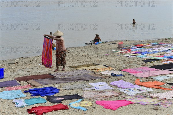 Washing clothes in the Irrawaddy, Myanmar, Asia