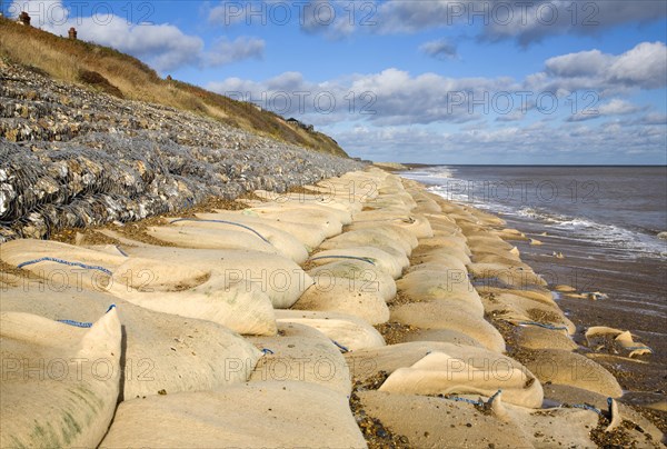 Coastal defences normally covered by shingle exposed by winter storms at Thorpeness, Suffolk, England in November 2013