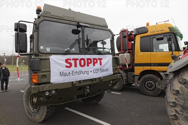 Banners against toll increase and CO2 tax on a truck, farmers' protests, demonstration against policies of the traffic light government, abolition of agricultural diesel subsidies, Duesseldorf, North Rhine-Westphalia, Germany, Europe