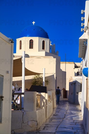 White church with blue dome in Oia, Santorini, Cyclades, Greece, Europe