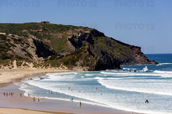Surfing beach Playa Bodeiro in the Algarve, wide, red rock, rocky coast, nobody, clear, blue sky, summer holiday, beach holiday, sea, ocean, Atlantic Ocean, Atlantic Ocean, sandy beach, coast, beach, Atlantic coast, national park, geography, climate, travel, sun, nature, natural landscape, beach landscape, Aljezur, Carrapateira, Sagres, Portugal, Europe