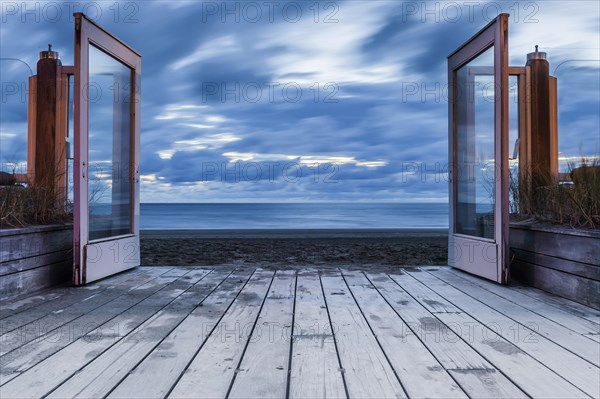 View through open glass door to the North Sea, clouds, movement, long exposure, move, cloudy sky, evening sky, stillness, view, future, emotion, silence, calm, window, freedom, distance, distance, evening hour, wind, air, art, mood, serenity, way, depth, open, symbol, symbolic, sea, ocean, breeze, blue hour, journey, holiday, promenade, Zandvoort, Holland, Netherlands