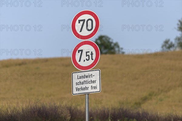 Traffic signs in front of a country lane, Mecklenburg-Vorpommern, Germany, Europe