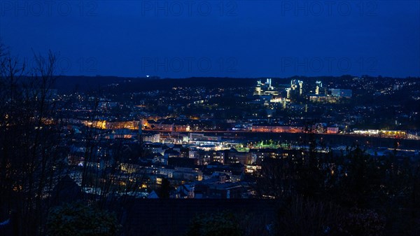 View of an illuminated cityscape during the blue hour with a clear evening sky, Bergische Universitaet, Elberfeld, Wuppertal, Bergisches Land, North Rhine-Westphalia
