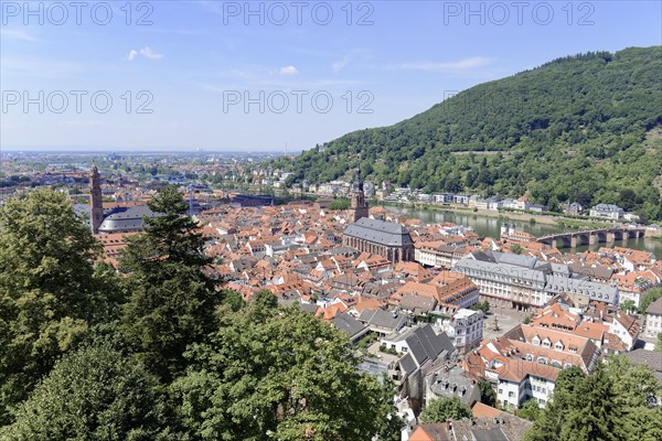 Sweeping views over the rooftops of a city with church towers and green hills, Heidelberg, Baden-Wuerttemberg, Germany, Europe