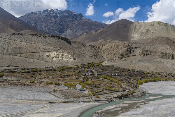 Tiny village in a huge dry riverbed, Kingdom of Mustang, Nepal, Asia