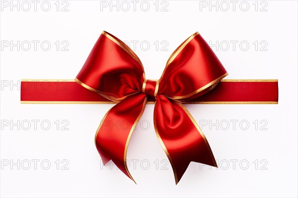 Festive red silk ribbonw ith golden edges on white background. KI generiert, generiert AI generated