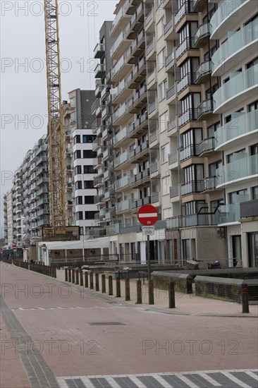 A street view with houses and a stop sign in an urban environment, Blankenberge, Flanders, Belgium, Europe