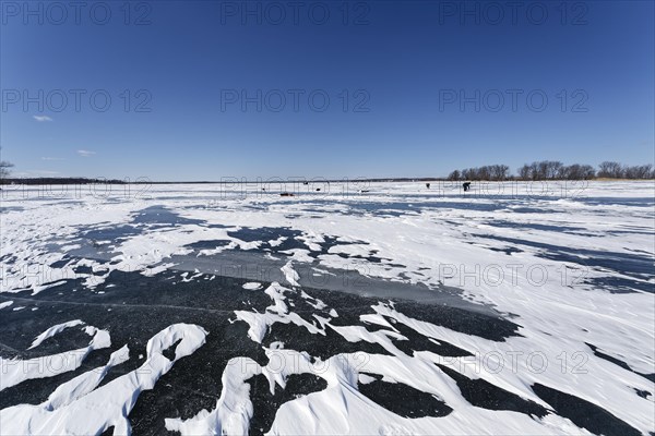 Winter, snow drifts on frozen riverscape, Saint Lawrence River, Province of Quebec, Canada, North America