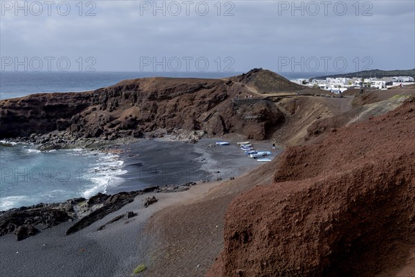 Fishing boats on the black beach of El Golfo, volcanic crater, Lanzarote, Canary Islands, Spain, Europe