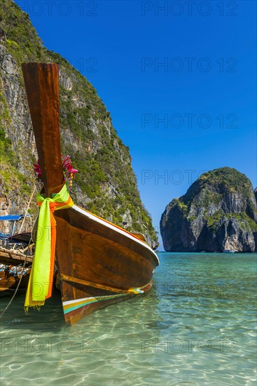 Longtail boat at Maya Bay, boat, wooden boat, ferry boat, ferry, passenger ferry, decorated, faith, tradition, Thai, Asian, traditional, sea, ocean, Andaman Sea, tropics, tropical, island, rock, rock, water, fisherman, fishing boat, travel, tourism, beach holiday, beach holiday, holiday, dream trip, holiday paradise, flora, paradise, coastal landscape, nature, idyllic, boat, turquoise, Siam, exotic, Ko Phi Phi Don, Thailand, Asia