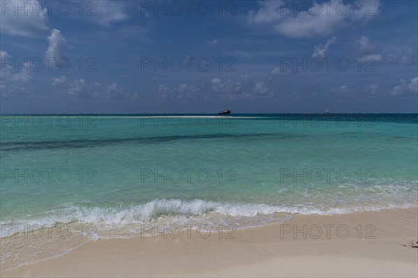 Turquoise waters on a white sand beach, Bangaram island, Lakshadweep archipelago, Union territory of India