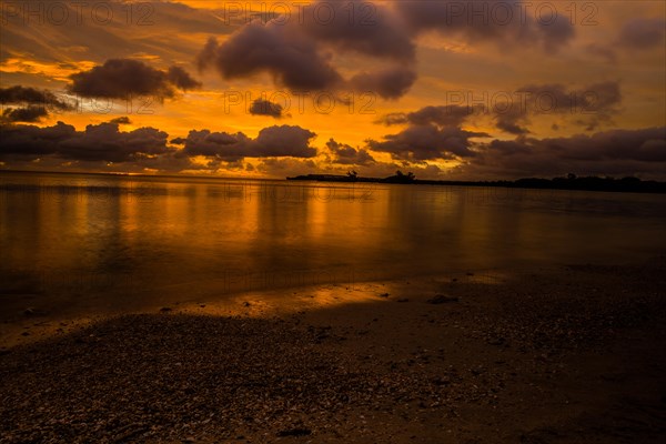 Beautiful sunset over ocean water taken from a beach in Guam