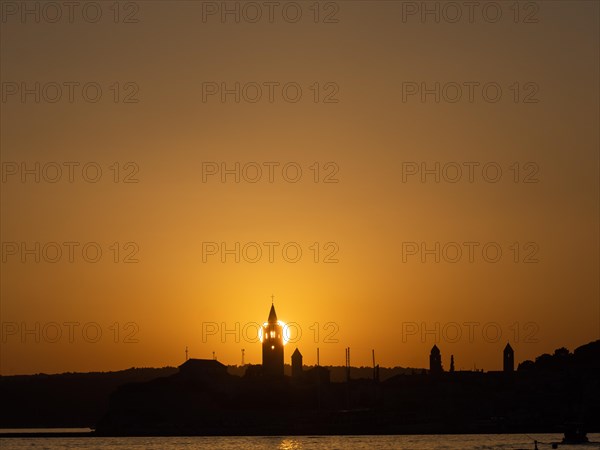 Sunset, silhouette of the church towers of Rab, town of Rab, island of Rab, Kvarner Gulf Bay, Croatia, Europe