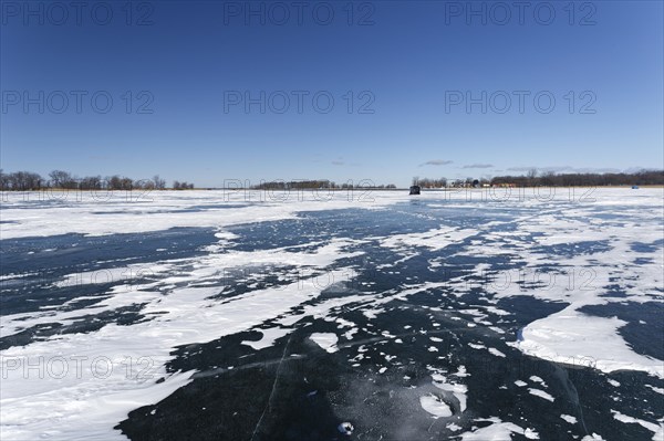 Winter, snow drifts on frozen riverscape, Saint Lawrence River, Province of Quebec, Canada, North America