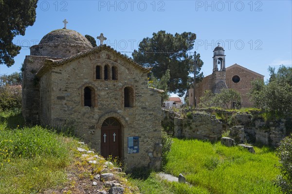 Ancient stone church surrounded by trees and vegetation, Temple of Apollo of ancient Assinai, Byzantine fortress, nunnery, monastery, Koroni, Pylos-Nestor, Messinia, Peloponnese, Greece, Europe