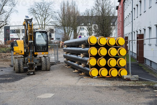 A stack of new district heating pipes on a construction site in Duesseldorf, Germany, Europe