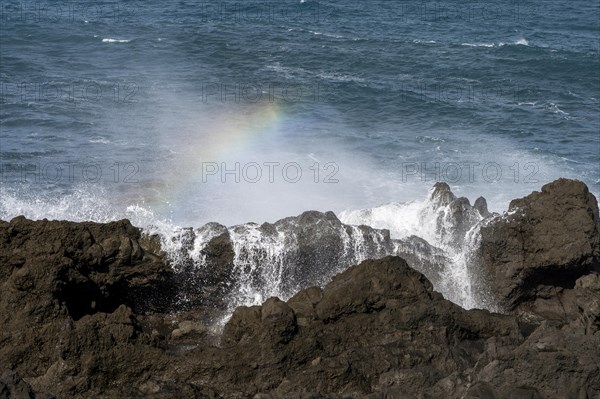 Surf with rainbow, near Los Hervideros, Lanzarote, Canary Islands, Spain, Europe