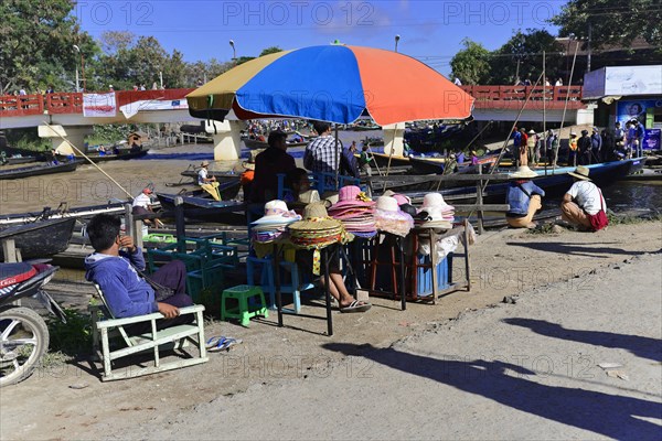 Colourful scene of a riverside street market with boats and people, Pindaya, Inle Lake, Myanmar, Asia