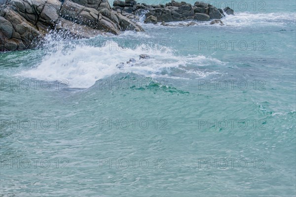 Dynamic ocean waves meeting the rugged coastline, in South Korea