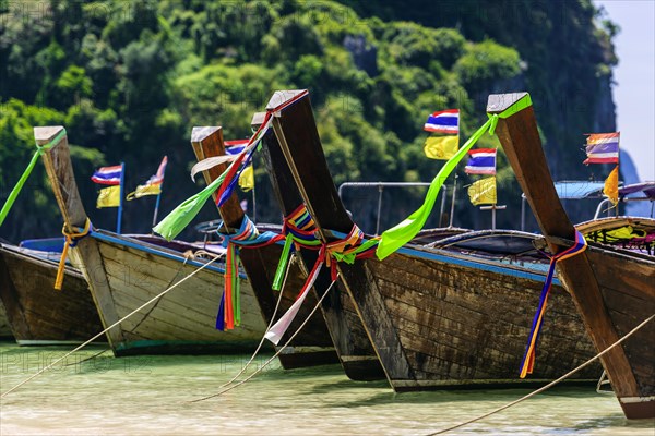 Longtail boat for transporting tourists, water taxi, taxi boat, ferry, ferry boat, fishing boat, wooden boat, boat, decorated, tradition, traditional, bay, sea, ocean, Andaman Sea, tropical, water, travel, tourism, paradisiacal, beach holiday, sun, sunny, holiday, idyllic, turquoise, Siam, exotic, travel photo, Krabi, Thailand, Asia