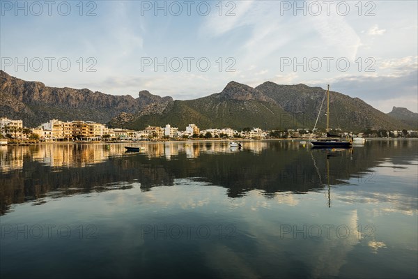 Village by the sea and mountains at sunrise, Port de Pollenca, Serra de Tramuntana, Majorca, Balearic Islands, Spain, Europe