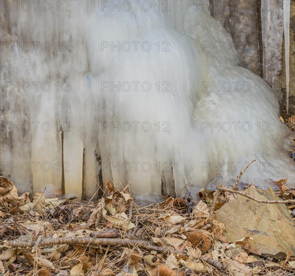 Close-up of icicles and ice from a partially frozen cascading waterfall, in South Korea