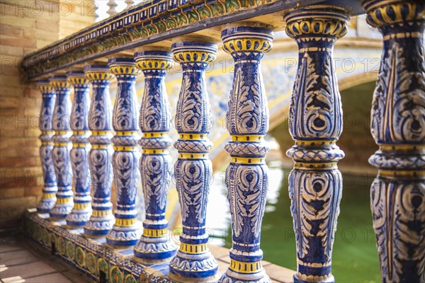 Close up of spanish tiles called azulejos on handrail at Plaza de Espana, Seville, Spain, Europe