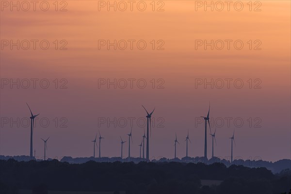 Wind turbines in the sunset, Schoenberg, Mecklenburg-Vorpommern, Germany, Europe