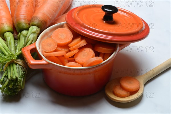Sliced carrots in pot and bunch Carrots, Daucus carota, carrots