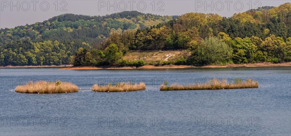 Landscape of lake with three small islands in the middle of lake in South Korea