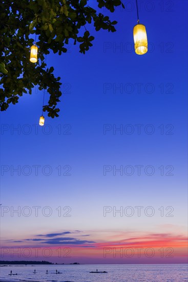 Evening mood at sunset with typical Thai lamps in the tree, sea, ocean, mood, evening mood, sky, evening light, holiday, travel, beach, emotion, calm, atmosphere, holiday paradise, Khao Lak, Thailand, Asia