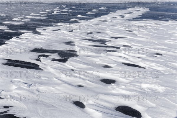 Winter, snow drifts on frozen riverscape, Saint Lawrence River, Province of Quebec, Canada, North America