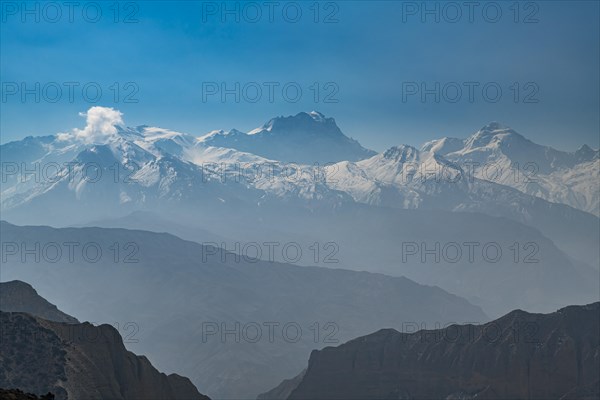 Desert mountain scenery with the Annapurna mountain range in the background, Kingdom of Mustang, Nepal, Asia