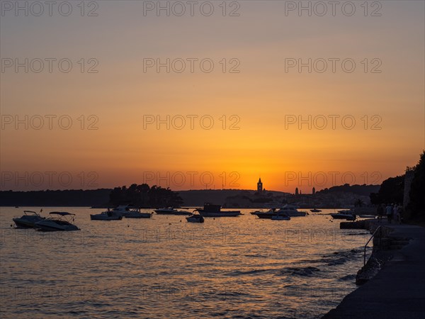 Sunset over a bay near the town of Rab, island of Rab, Kvarner Gulf Bay, Croatia, Europe