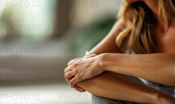A woman sits with crossed legs, hands on knees, in a relaxed pose wearing casual attire AI generated