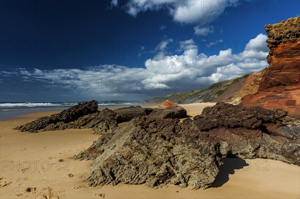 Algarve beach, wide, red rock, rocky coast, nobody, clear, blue sky, cloud, summer holiday, beach holiday, sea, ocean, Atlantic, Atlantic Ocean, sandy beach, coast, Atlantic coast, national park, geography, climate, travel, neutral, empty, sun, nature, natural landscape, beach landscape, surfer beach, Aljezur, Carrapateira, Sagres, Portugal, Europe