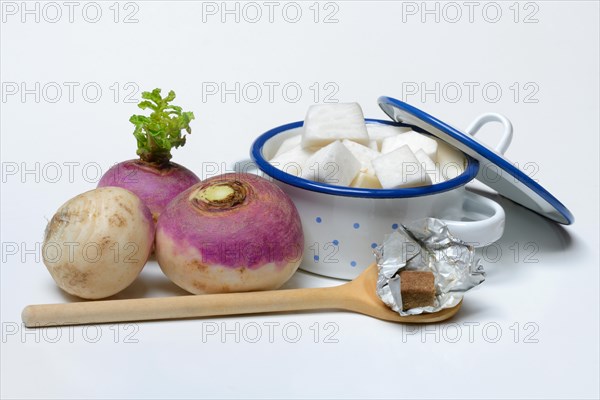 Purple beetroot and sliced beetroot in pot, cooking spoon with stock cube, Brassica rapa