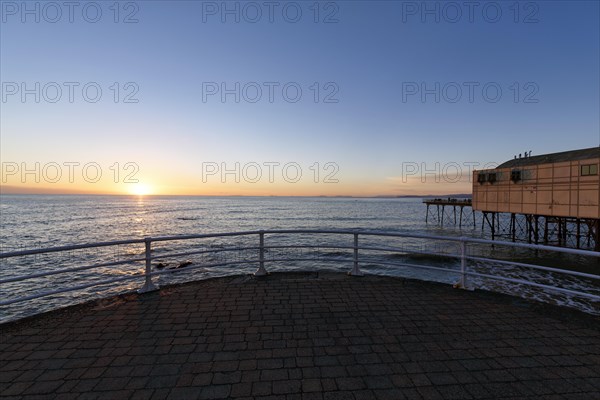 Sunset at the pleasure pier, Royal Pier, Cardigan Bay, Aberystwyth, Ceredigion, Wales, Great Britain