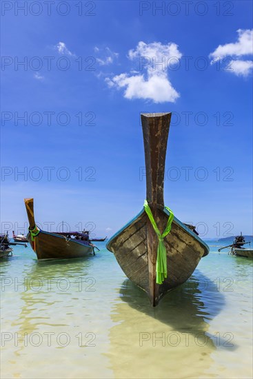 Longtail boat for transporting tourists, water taxi, taxi boat, ferry, ferry boat, fishing boat, wooden boat, boat, decorated, tradition, weather, traditional, bay, sea, ocean, Andaman Sea, tropics, tropical, water, travel, tourism, paradise, beach holiday, sun, sunny, holiday, idyllic, turquoise, Siam, exotic, travel photo, Krabi, Thailand, Asia