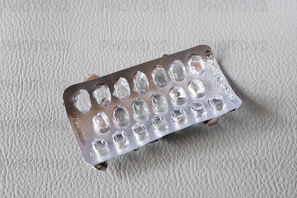 Symbolic image of medication misuse, empty blister pack