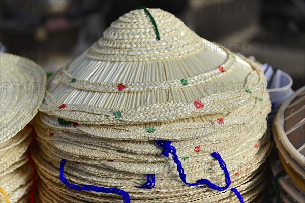 Pile of traditional Asian conical hats, decorated with various patterns, Inle Lake, Myanmar, Asia