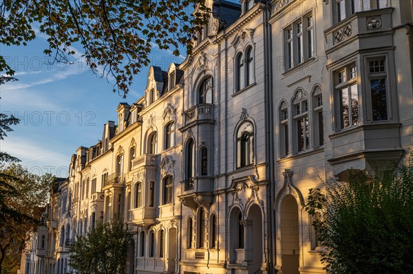 The sun illuminates old building facades in the morning light, Wilhelminian style, Briller Viertel, Elberfeld, Wuppertal, North Rhine-Westphalia