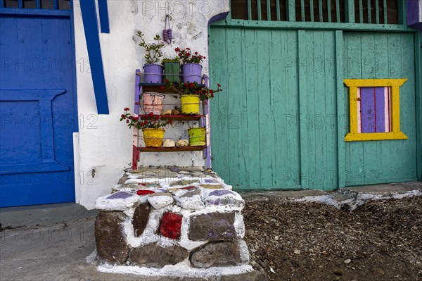 Flower pots decorate a facade, Climate, Milos, Cyclades, Greece, Europe