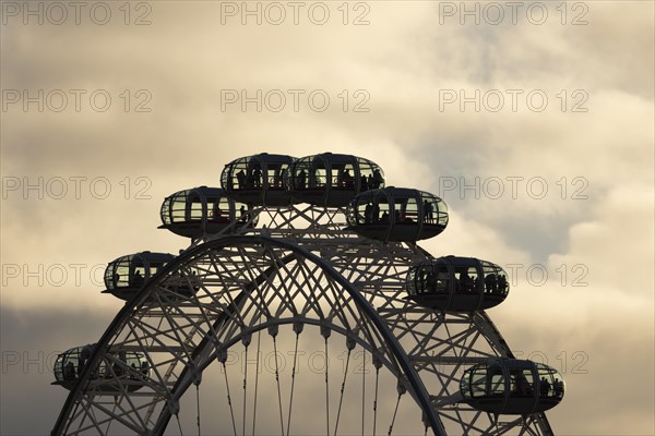 London Eye or Millennium Wheel tourist observation wheel close up of pods at sunset, City of London, England, United Kingdom, Europe