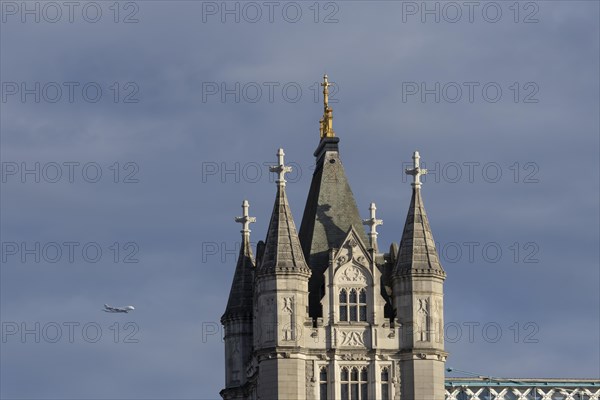 Airbus A380 aircraft of Emirates airlines in flight with Tower Bridge in the foreground, London, England, United Kingdom, Europe